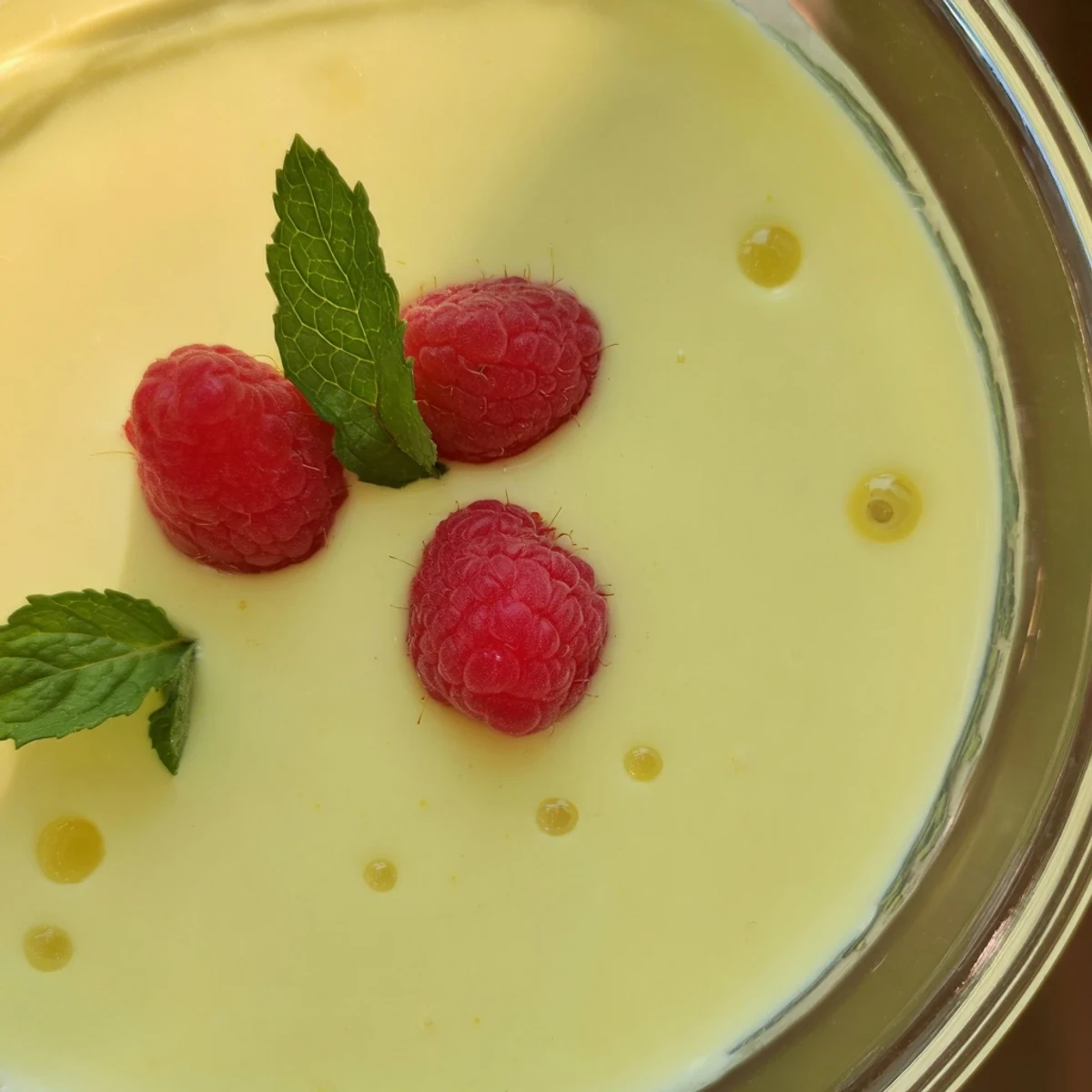 Silky smooth lemon posset dessert served chilled with vibrant citrus zest garnish