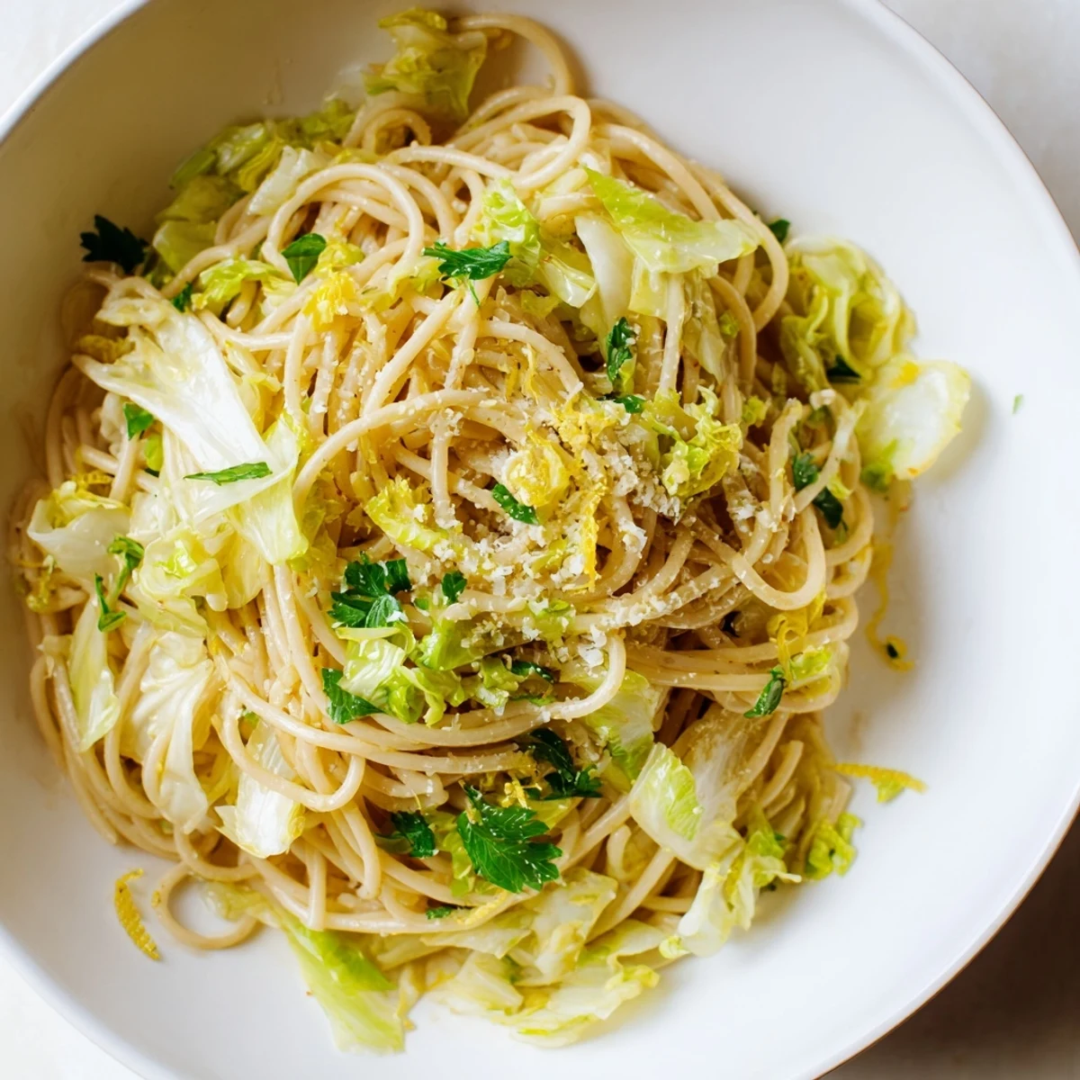 Golden pasta strands tossed with tender cabbage in a bright lemon garlic butter sauce