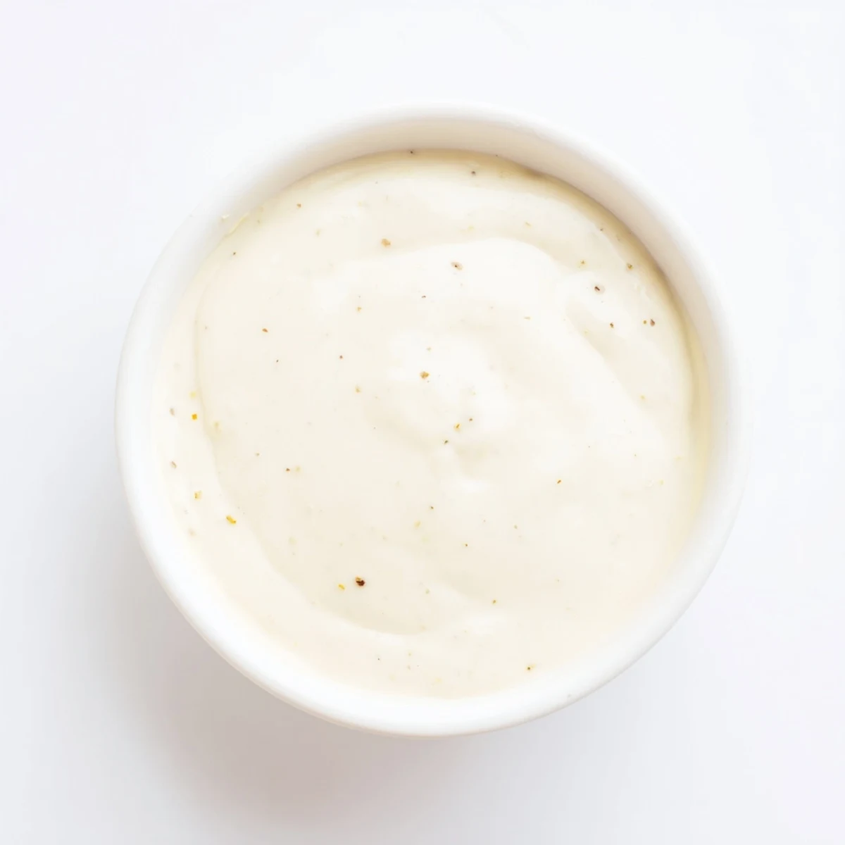 Creamy chicken shawarma garlic sauce drizzled generously over seasoned sliced chicken and warm pita bread