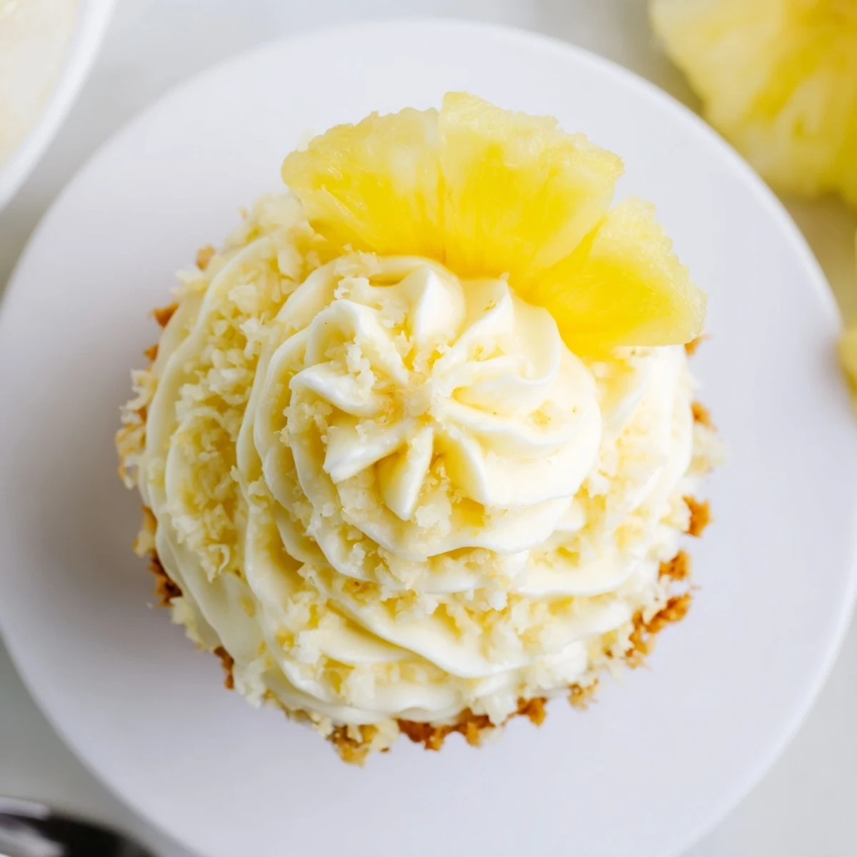 Dole Whip Cupcakes with creamy pineapple frosting and soft, fluffy crumb