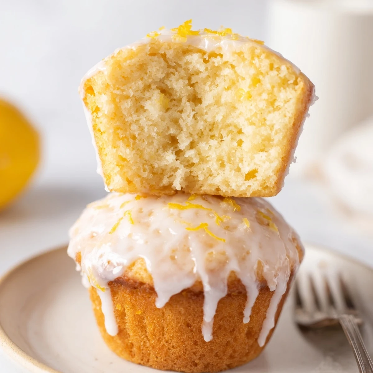 Warm Glazed Lemon Ginger Muffins cooling on rack, zesty aroma fills kitchen