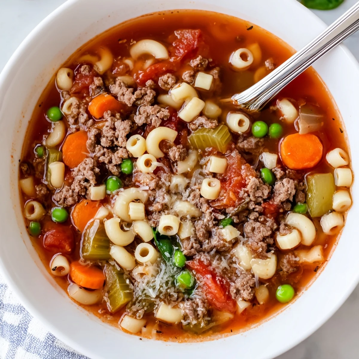 Bowl of Delicious Homemade Ground Beef Pasta Soup Recipe For Comfort, warm and aromatic.