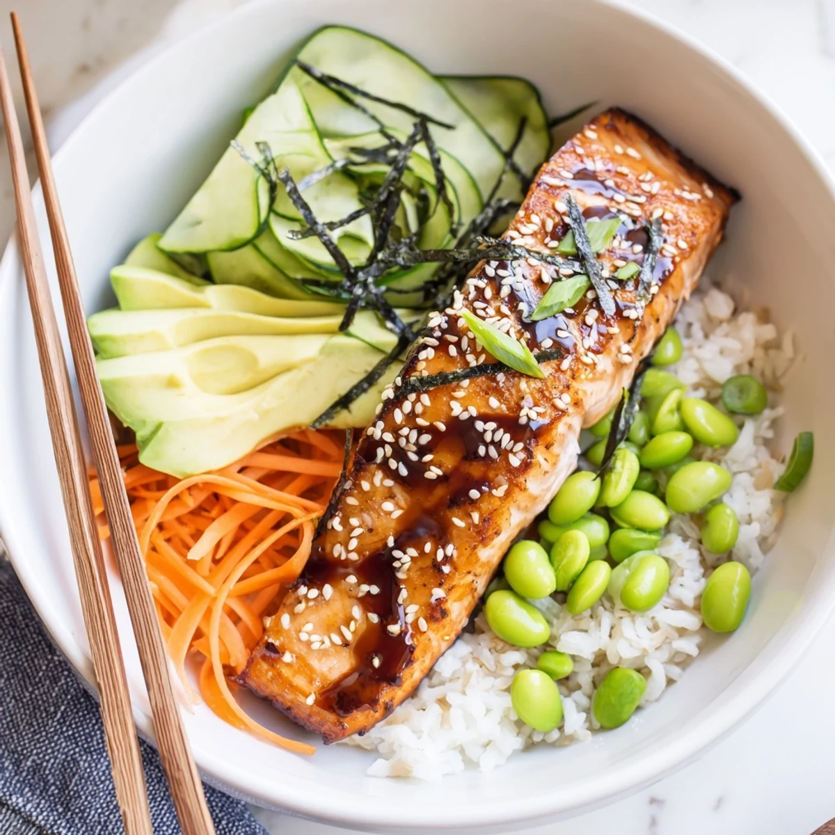 Pan-seared fillets atop fluffy rice in a Crispy Salmon And Rice Bowl.