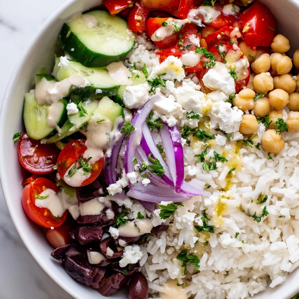 Steaming Mediterranean Rice Bowl drizzled with tangy lemon-tahini dressing and fresh herbs