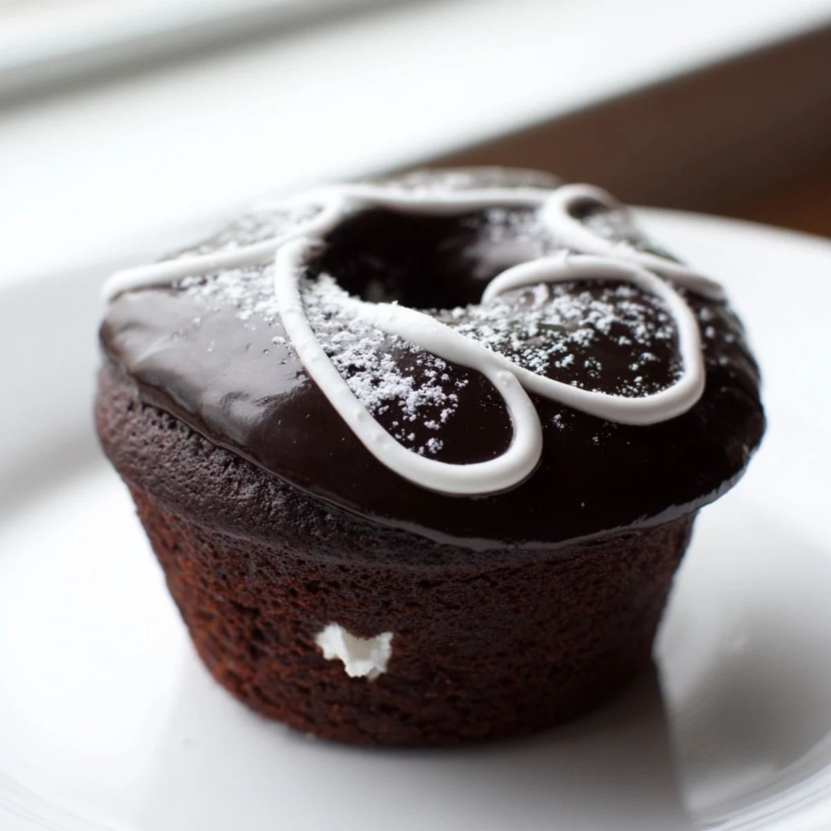 Homemade Hostess Cupcakes with glossy ganache and pillowy marshmallow filling