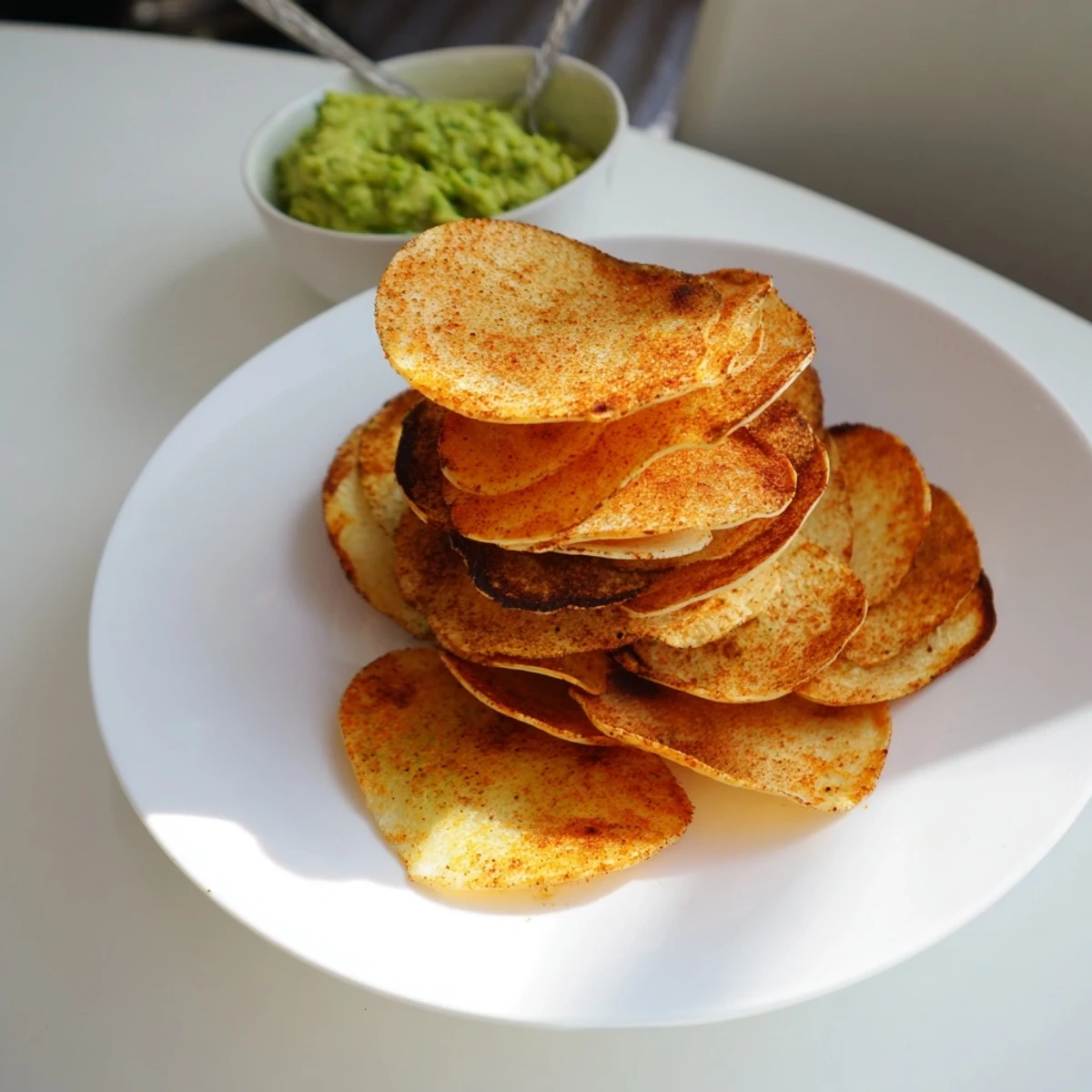 Crispy seasoned cottage cheese chips cooling on a baking sheet after baking